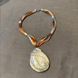 Satin and seashell necklace.